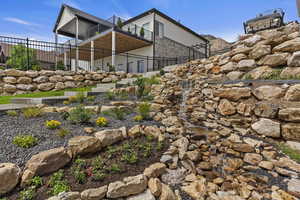 View of yard featuring a balcony