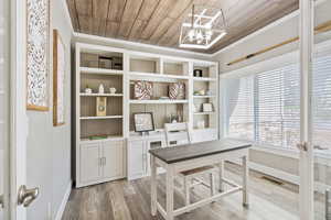 Office with crown molding, french doors, wooden ceiling, and wood-type flooring