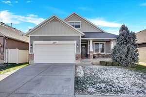 Craftsman-style home featuring a garage