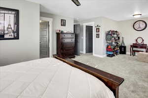 Bedroom featuring carpet flooring and ceiling fan