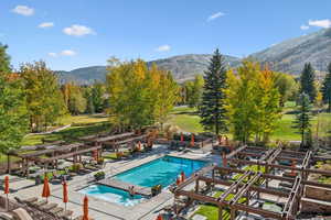 View of swimming pool featuring a mountain view and a patio