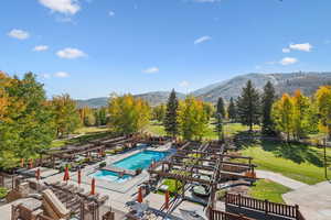 View of swimming pool featuring a mountain view and a patio