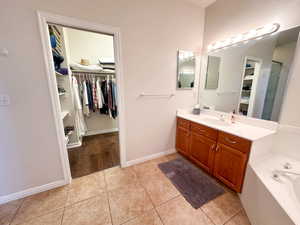 Bathroom featuring tile patterned floors and vanity