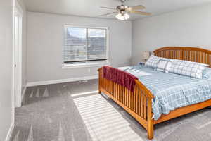 Bedroom with carpet flooring and ceiling fan