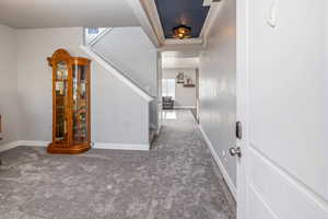 Stairway featuring carpet flooring