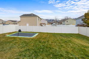 View of yard with a trampoline