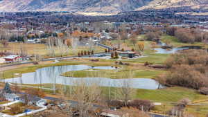 Exterior space with a water and mountain view