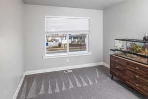 Unfurnished bedroom featuring carpet flooring