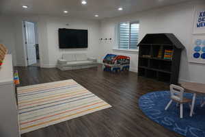 Living room featuring dark hardwood / wood-style flooring