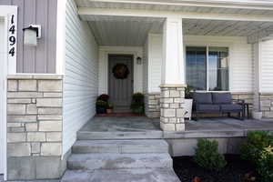 Entrance to property with covered porch