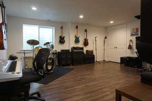 Workout room featuring dark hardwood / wood-style floors