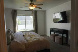 Bedroom featuring carpet floors and ceiling fan