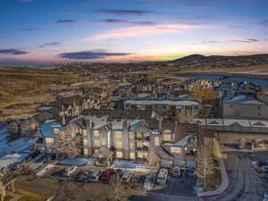 Aerial view at dusk featuring a mountain view