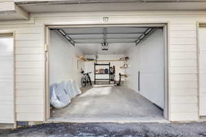 Garage featuring wooden walls and a garage door opener