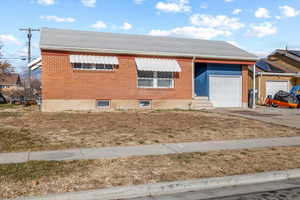 View of front of property featuring a garage