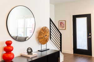 Foyer entrance featuring dark wood-type flooring