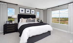 Bedroom featuring light carpet. TO BE BUILT. Some features and finishes may be different than picture.