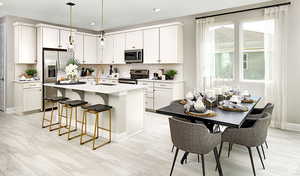 Kitchen will not be L shaped Kitchen 2 as pictured here. TO BE BUILT. Some features and finishes may be different than picture. Will include gas stove, dishwasher. microwave, and refrigerator.