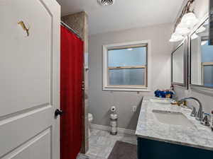 Bathroom with vanity and toilet