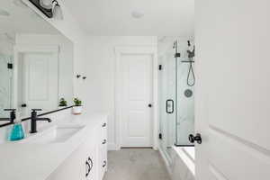 En suite Bathroom featuring vanity and an enclosed shower