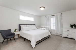 View of main bedroom, carpeted floors.