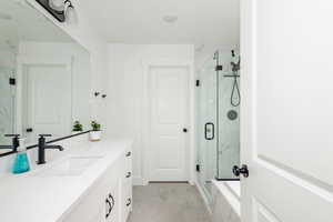 En suite Bathroom with vanity and an enclosed shower