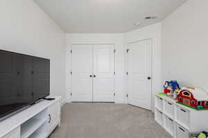 View of carpeted bedroom