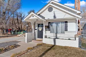 View of front of property with a front lawn