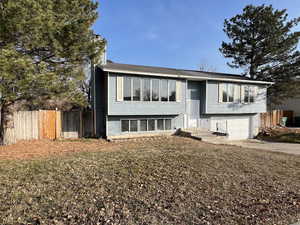 Raised ranch featuring a garage