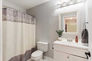 Bathroom featuring vanity and toilet