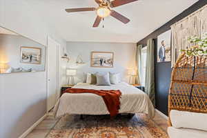 Bedroom with ceiling fan and wood-type flooring