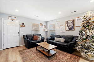 Living room with light wood-type flooring