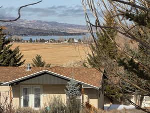 Mountain view featuring a water view