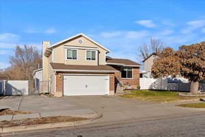 View of front of property featuring a garage