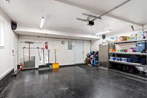 Garage with a garage door opener and electric panel