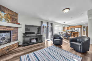 Living room with hardwood / wood-style flooring