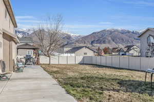 View of yard with a mountain view, a gazebo, and a patio