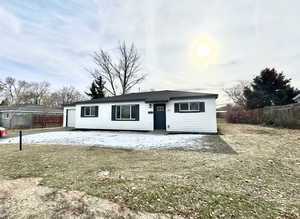 View of front of house with a front yard