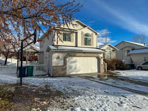 View of front property featuring a garage