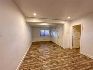 Unfurnished room featuring dark hardwood / wood-style floors