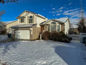 View of front facade featuring a garage