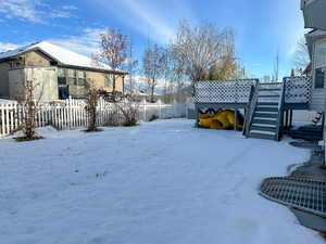 View of yard covered in snow