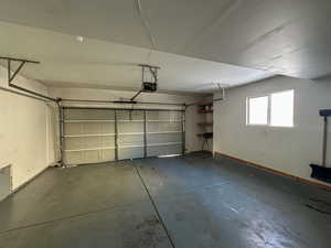 Garage featuring a garage door opener