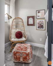 Sitting room with carpet flooring