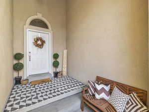 Welcoming front entrance with covered patio