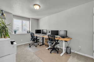 Basement Bedroom, currently used as an office & workout area