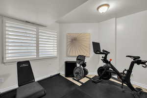 Workout area featuring a textured ceiling