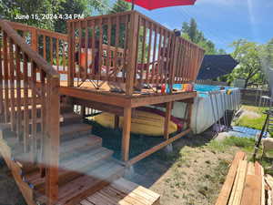 Wooden deck to make it easier to enter pool.