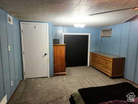 Bedroom with light colored carpet