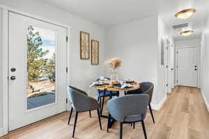 Dining space with light wood-type flooring